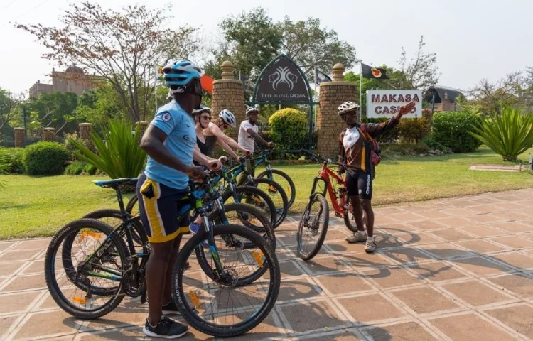 Helmeted cyclists stopped with their bicycles during a guided tour