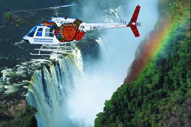 Helicopter above Victoria Falls and its mist-filled gorge